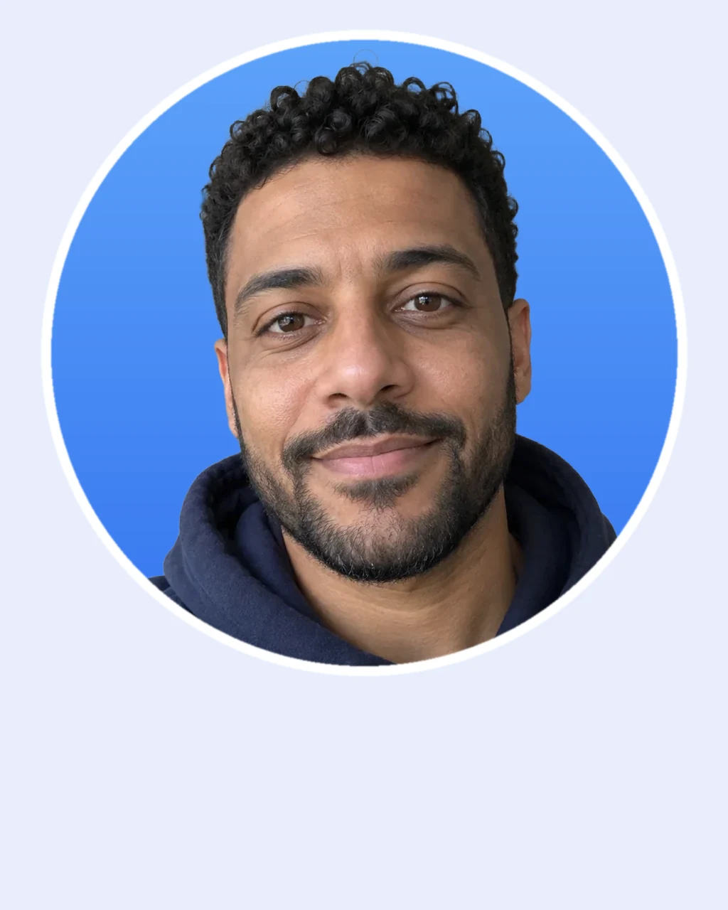 The man in a round profile picture on a blue background